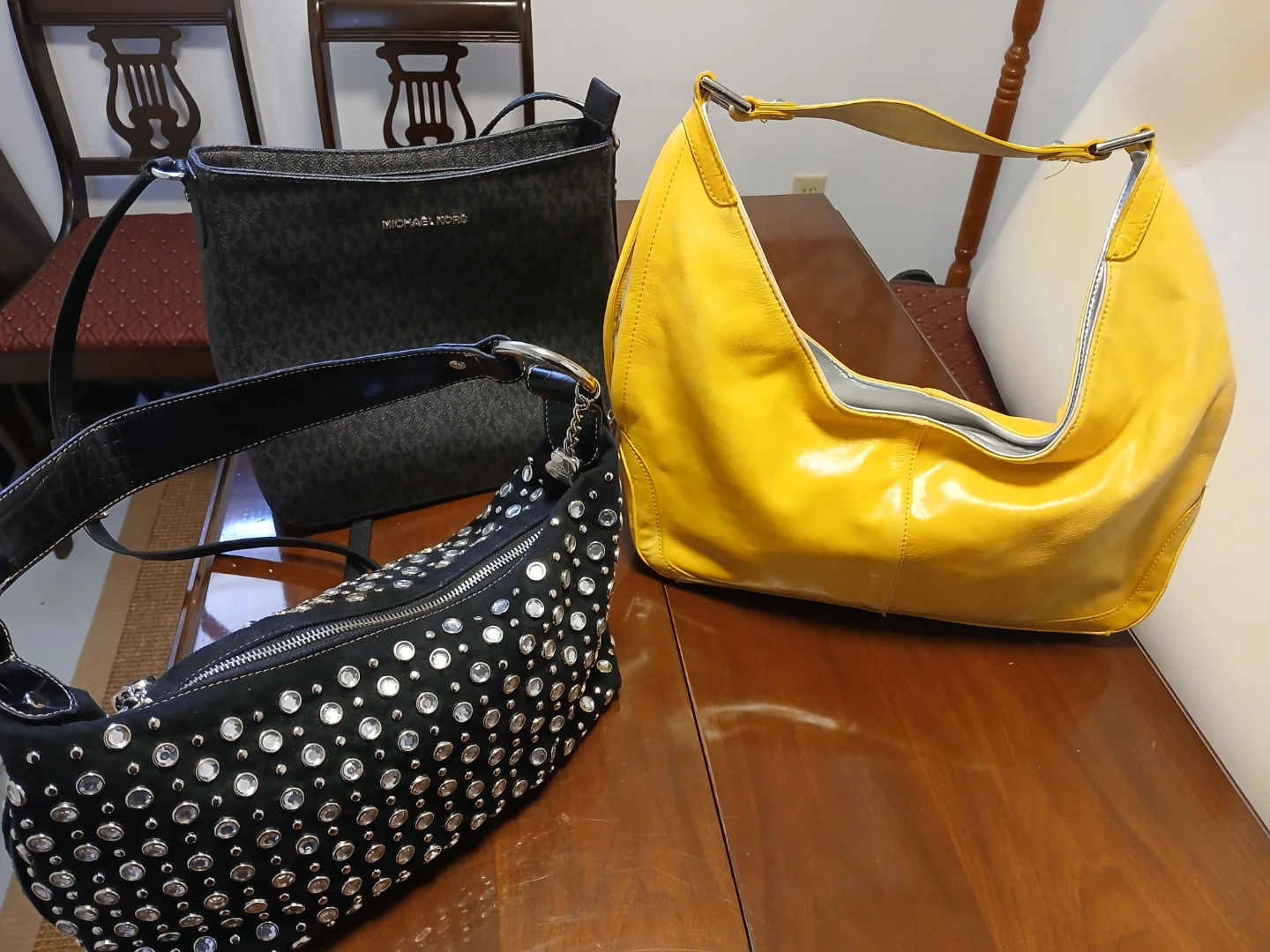 Three leather purses...Kenneth Cole, Michael Kors and Kathy Z