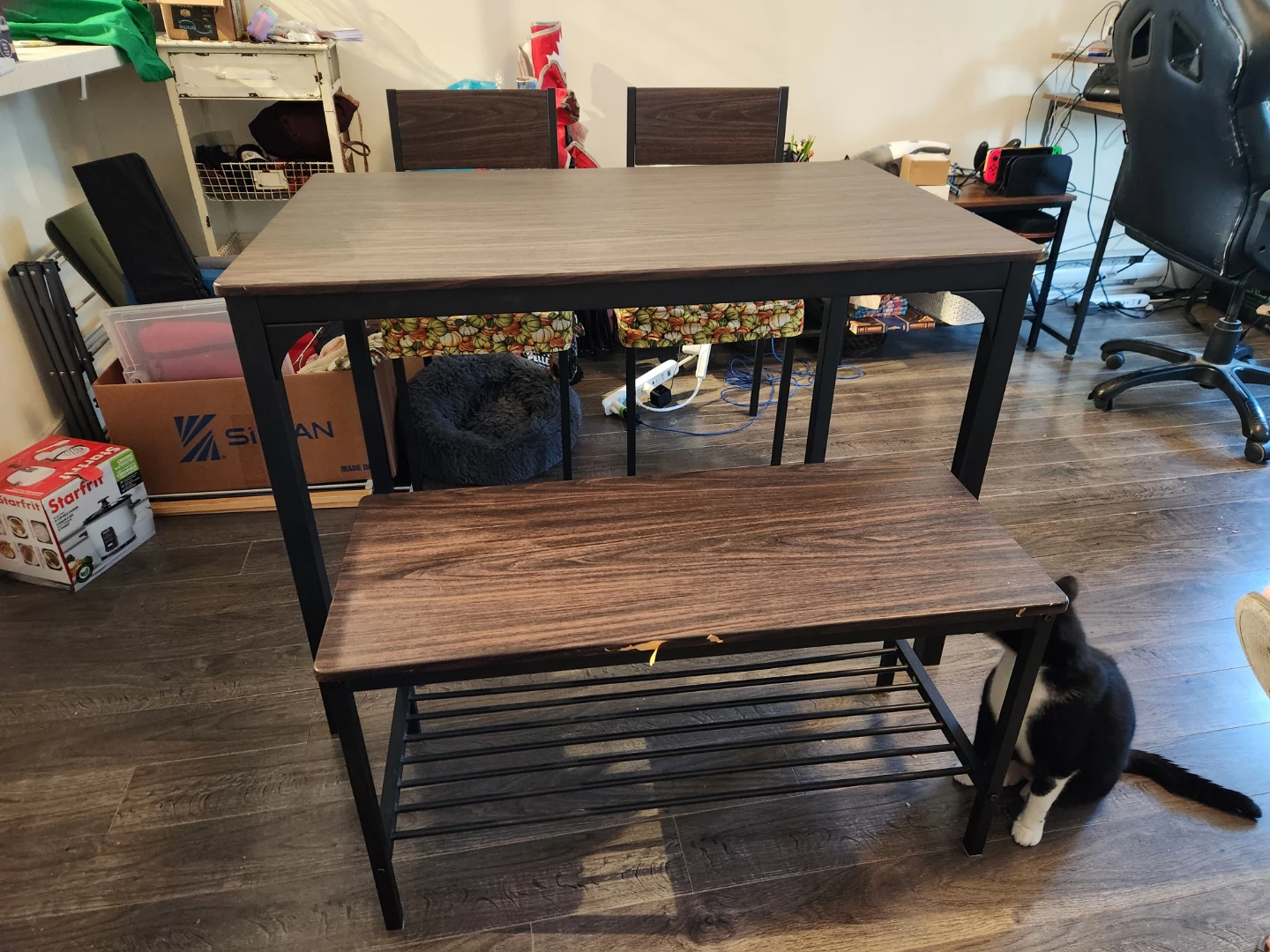 Table with two chairs and bench