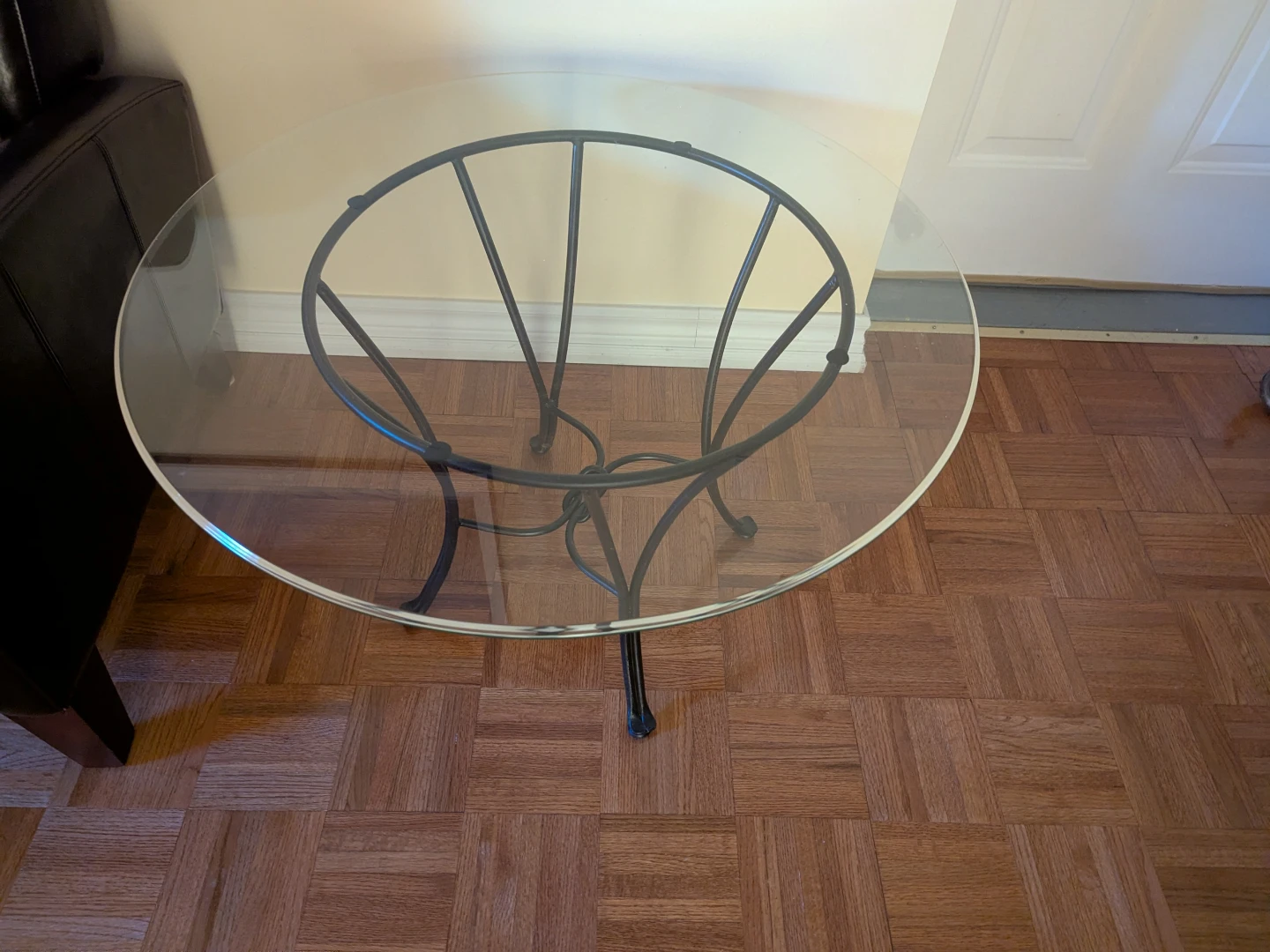 Round Glass Coffee Table with Black Metal Base