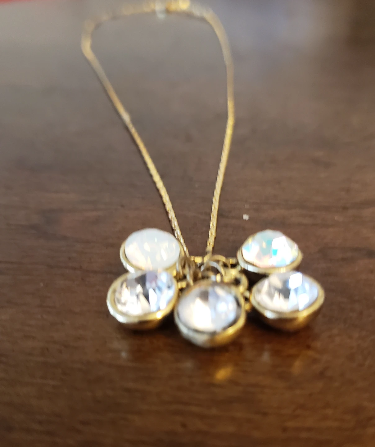 Gold tone pendant necklace with clear and iridescent charms - photo 3