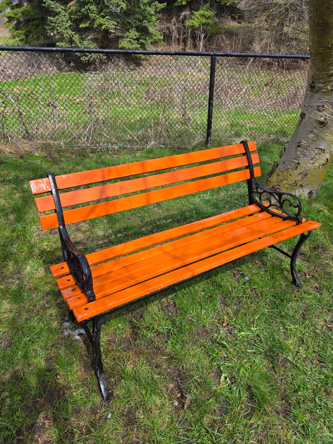 Orange Metal and Wood Park Bench