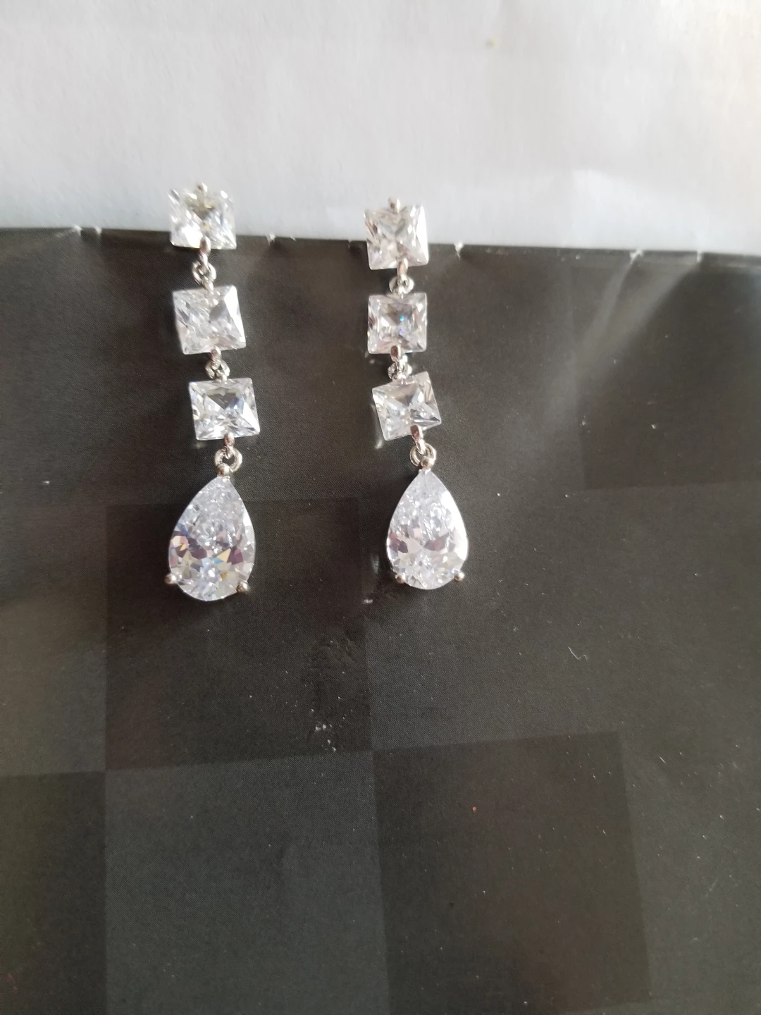 Silver-tone teardrop dangle earrings with cubic zirconia