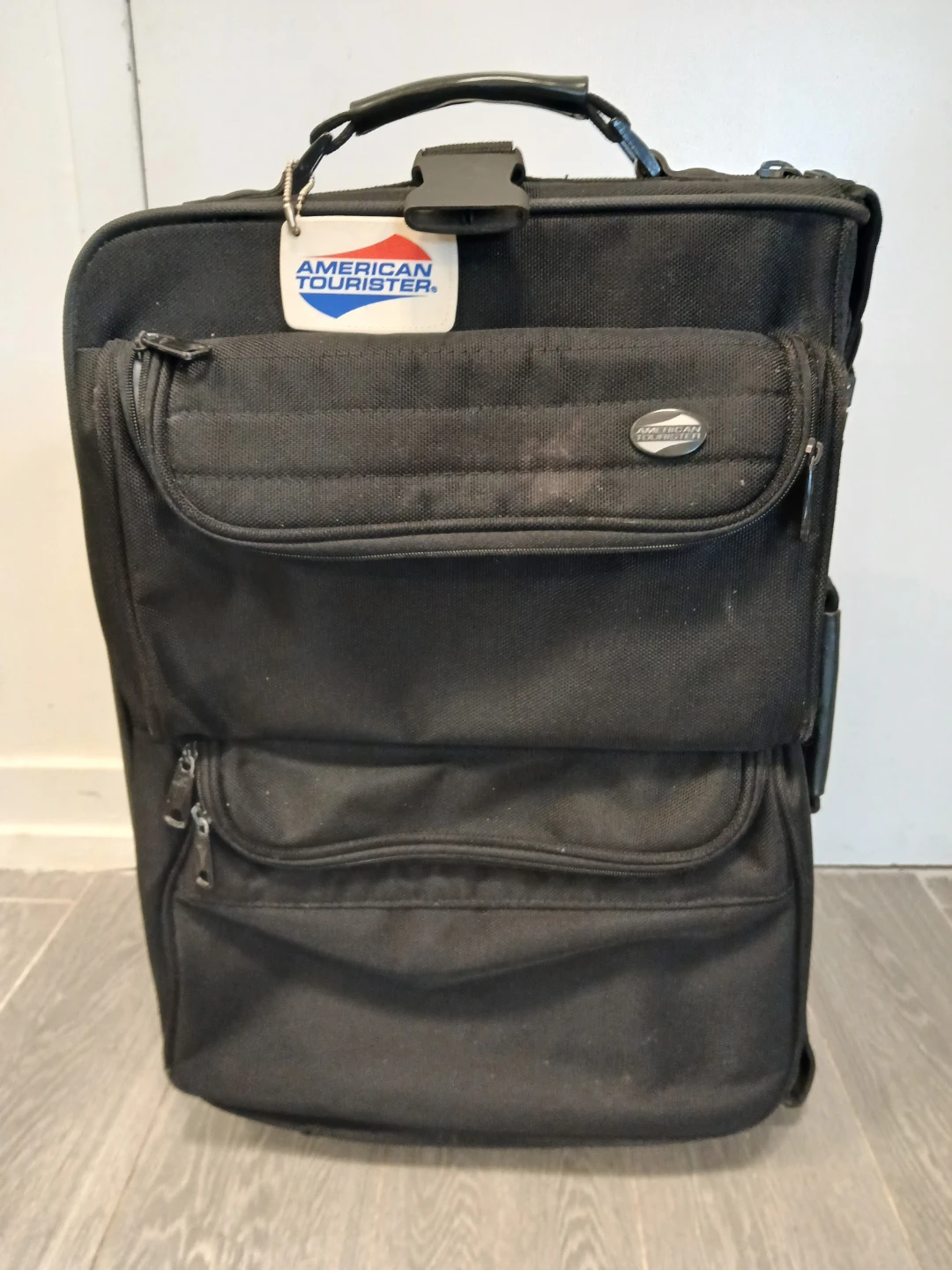 American Tourister Black Rolling Suitcase. It's available.