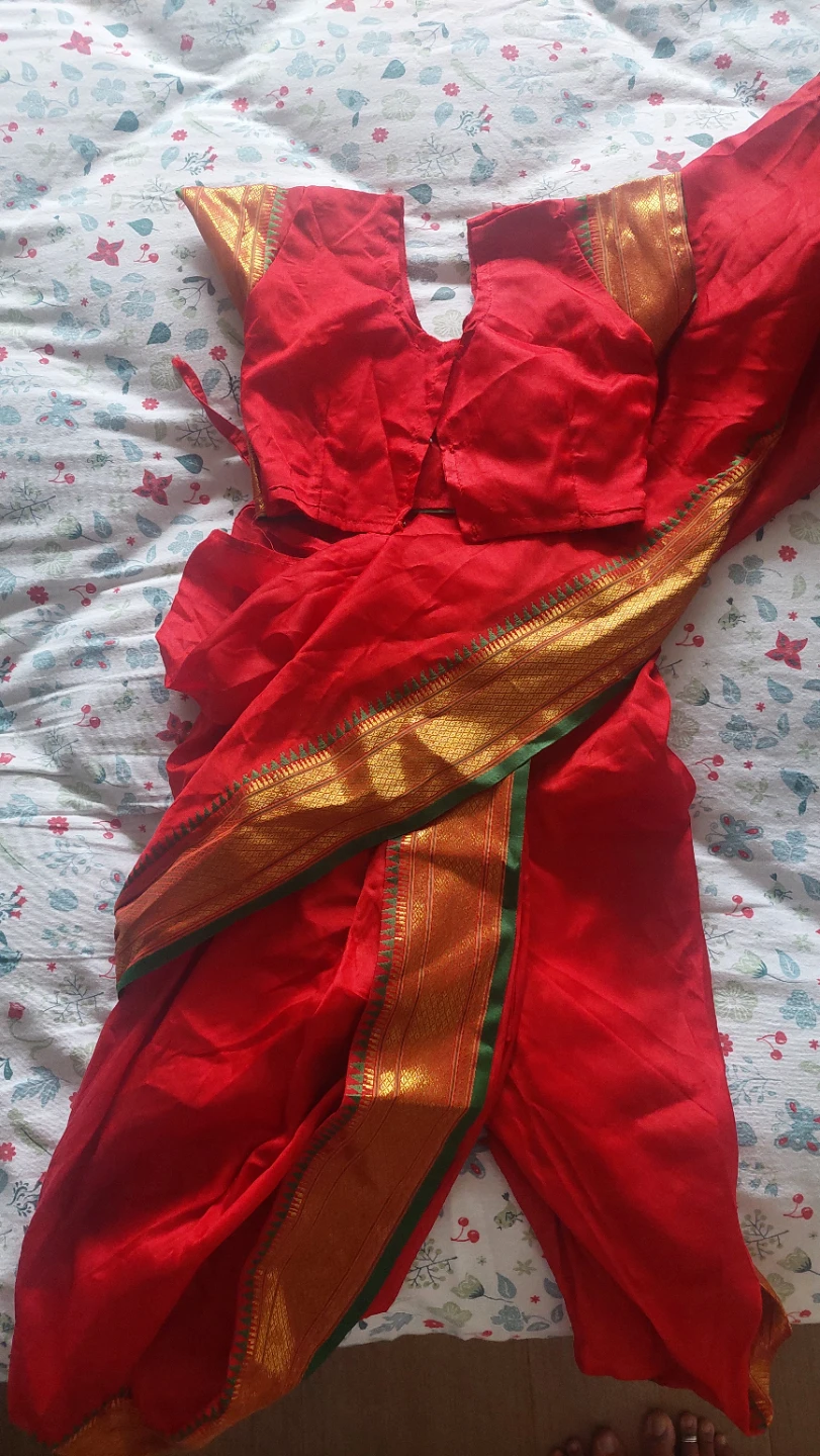 Red traditional Indian outfit with gold trim