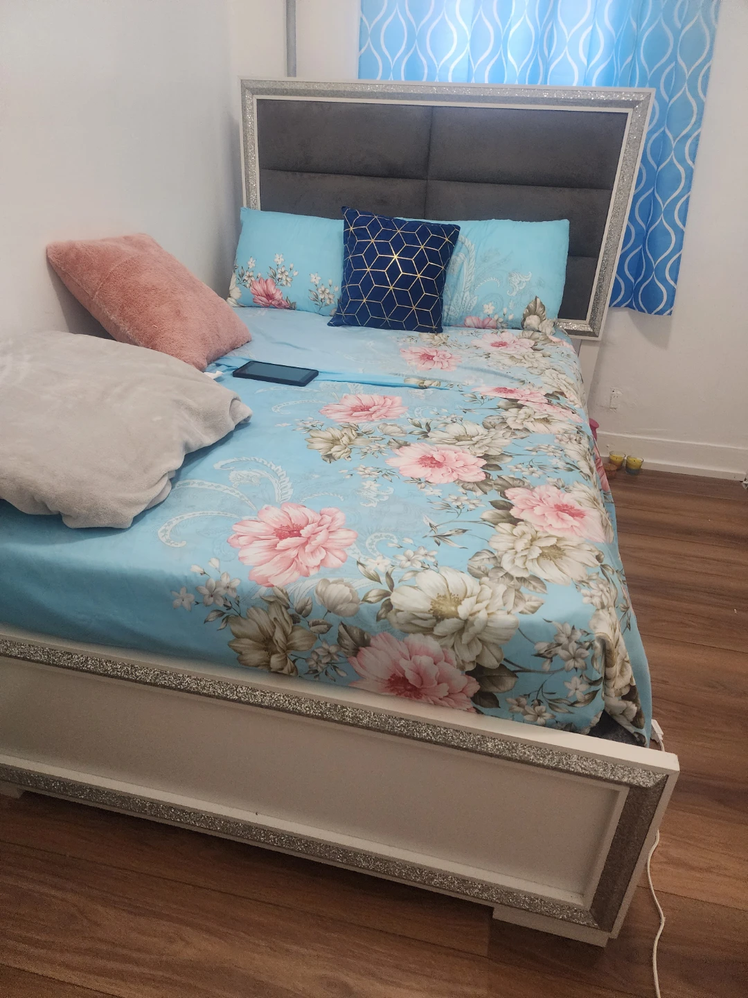 Queen Bed Frame with Upholstered Headboard and Floral Bedding