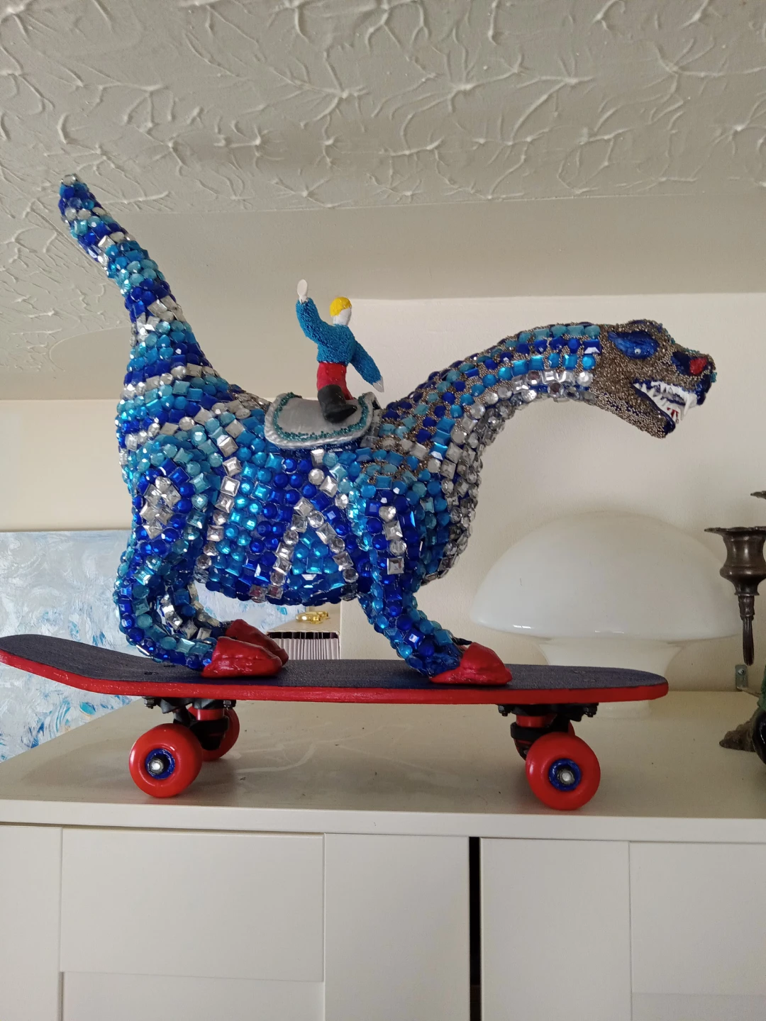 Dinosaur Riding Skateboard Sculpture