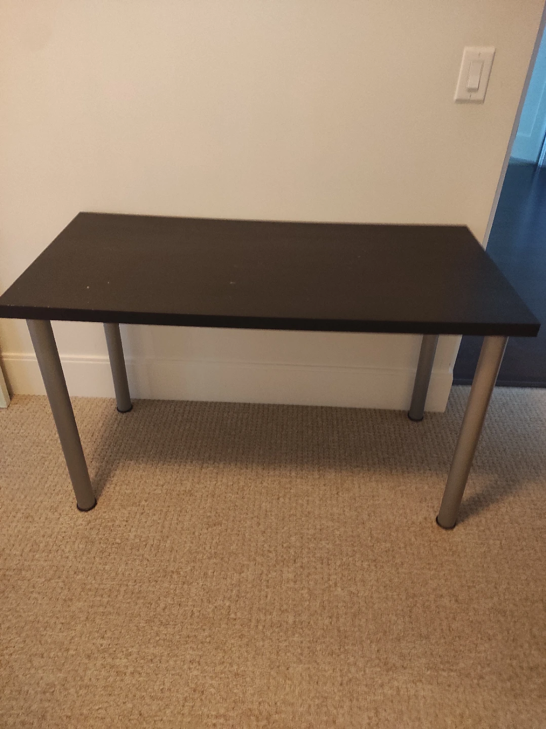 Black writing desk with silver legs