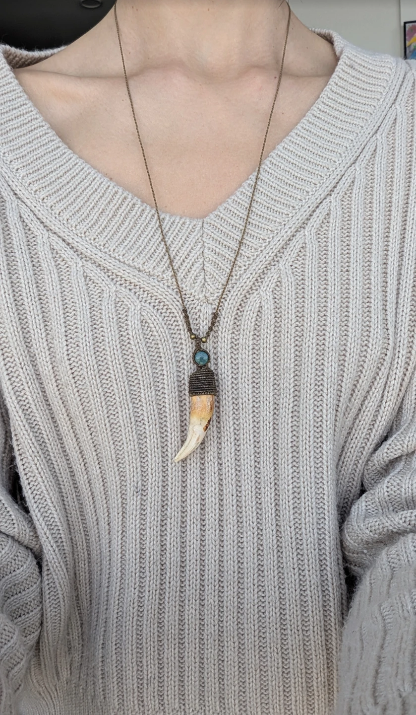 Real and unique wild boar tusk pendant.