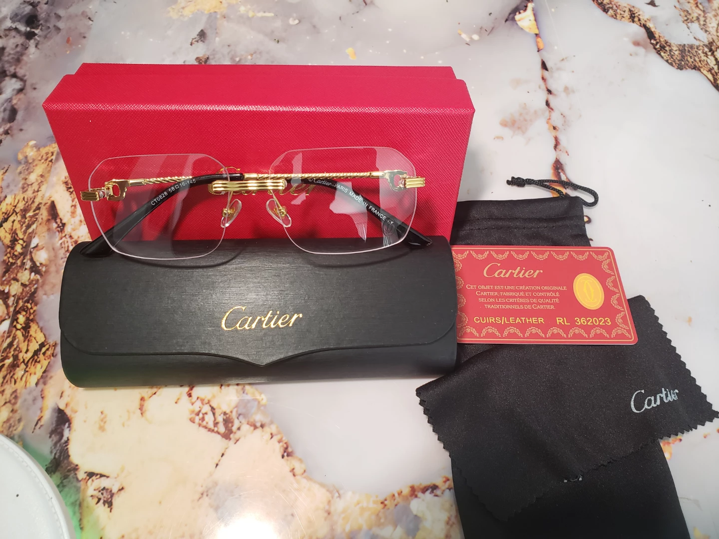 Cartier CT0028 Eyeglasses - Gold/Black Rimless 58-16-145