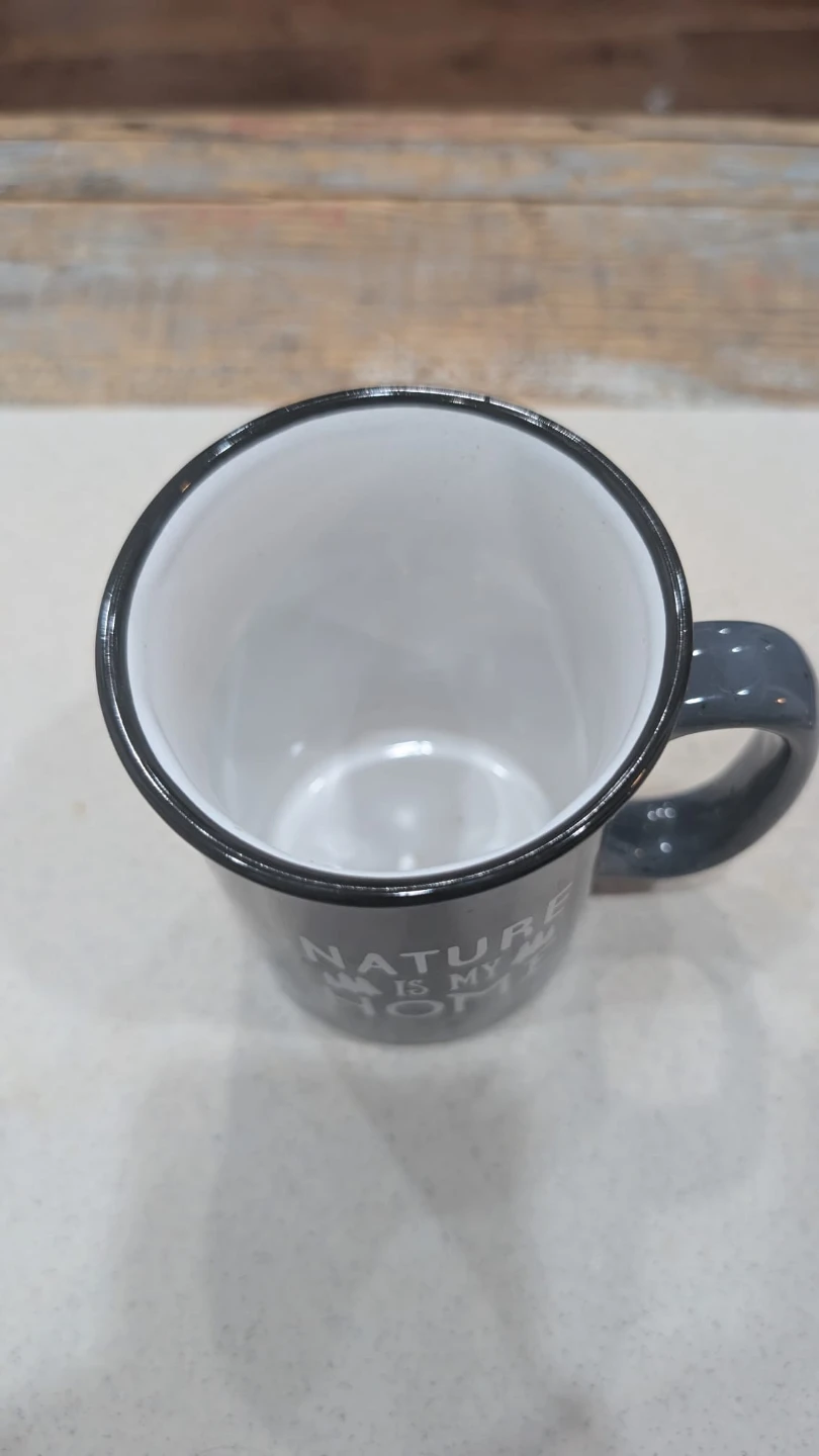 Mug with "NATURE IS MY HOME" graphic