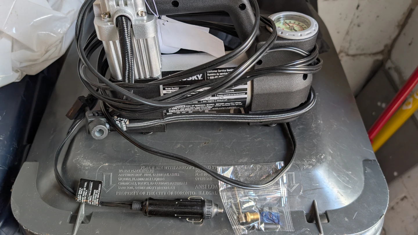 Car tire pump, built in cigarette lighter power adapter.