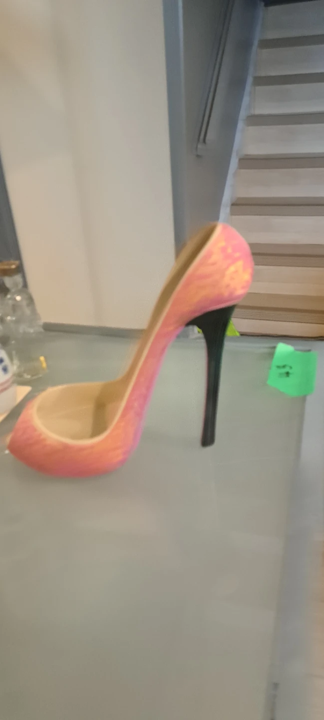 This is a wine holder designed like shoe