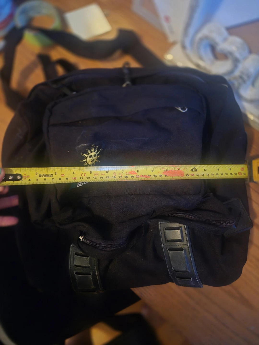 Black Backpack with Sun Emblem