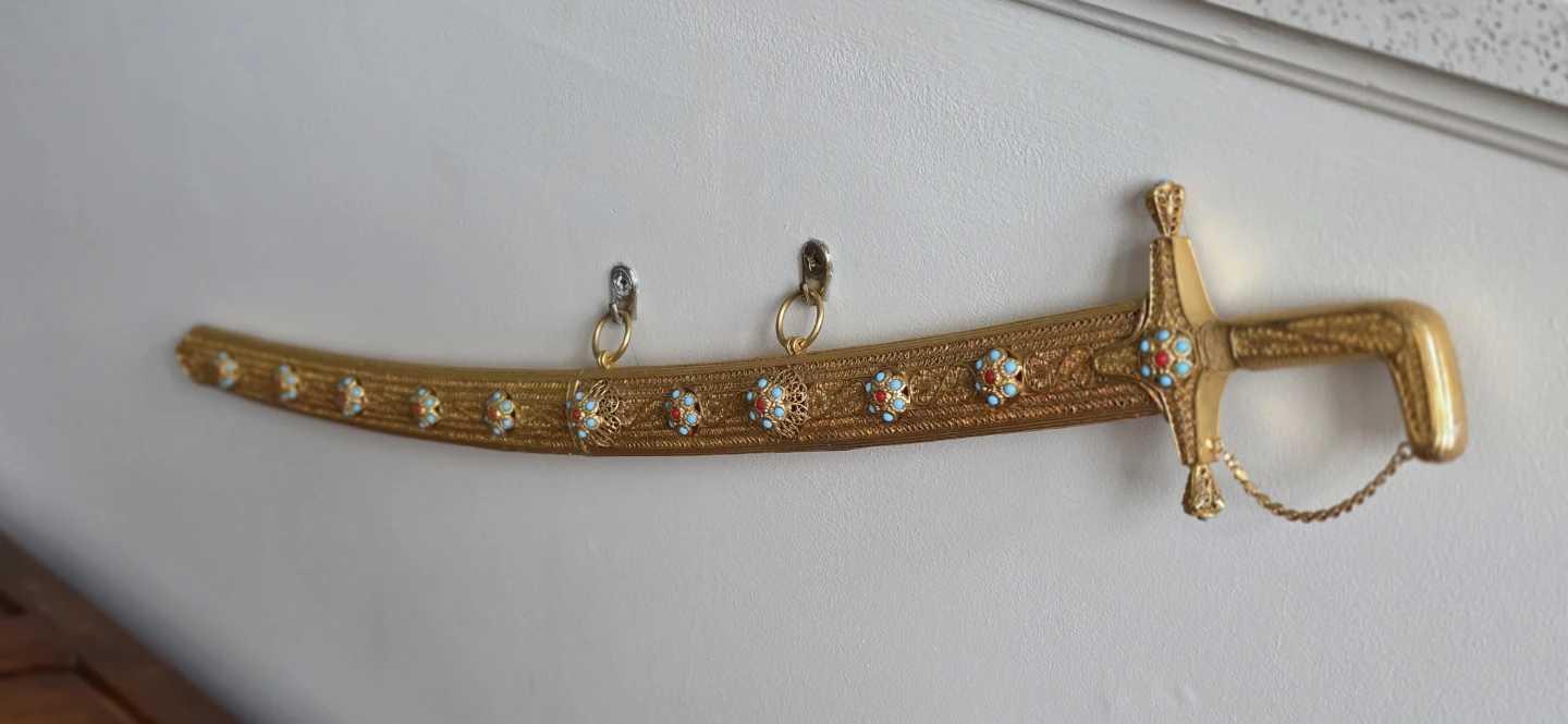 Decorative Gold Sword with Embellished Scabbard