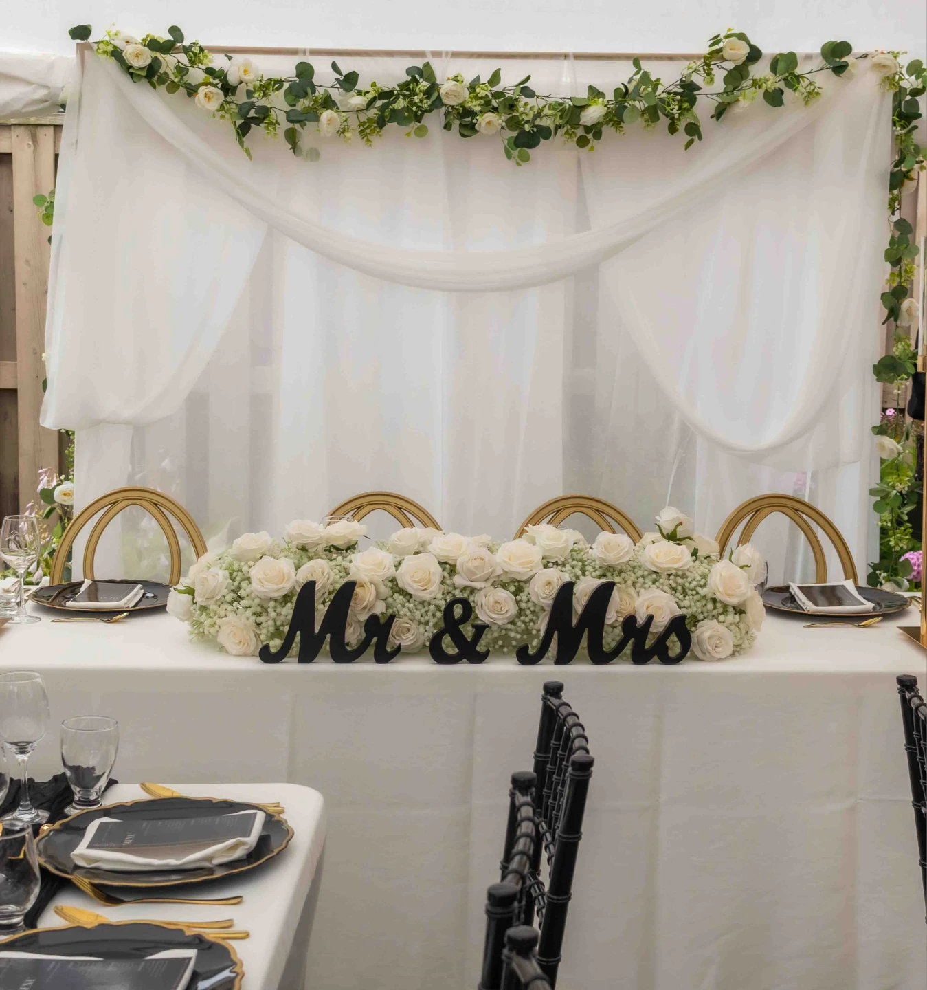 White sheer fabric & artificial flower garland