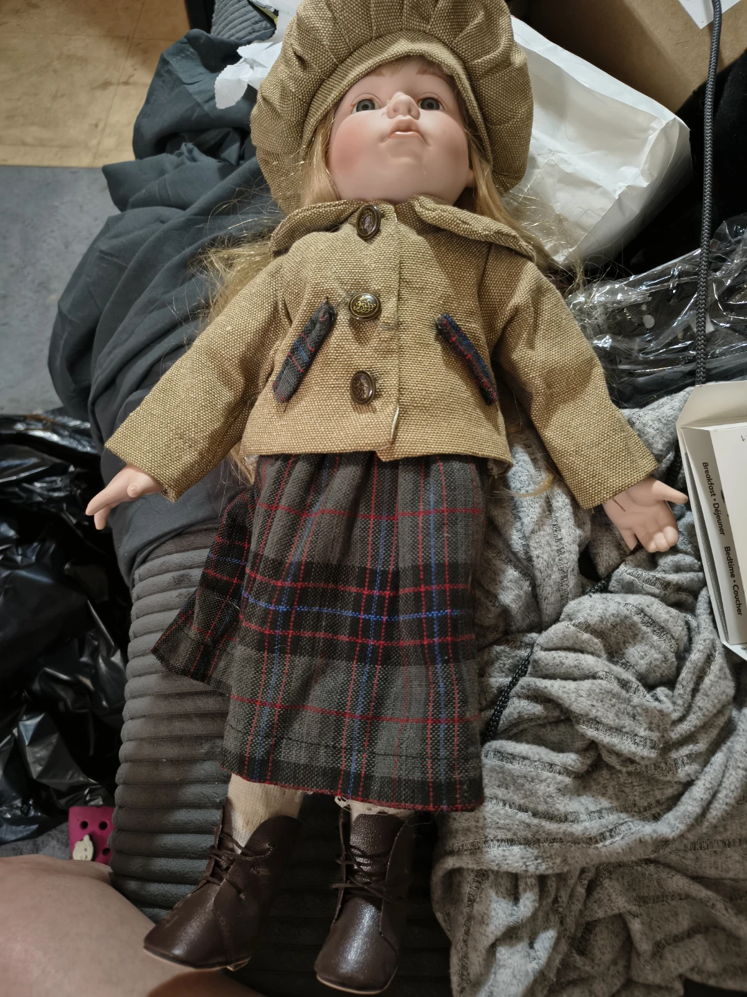 Collectible porcelain Doll with Tartan Skirt and Hat