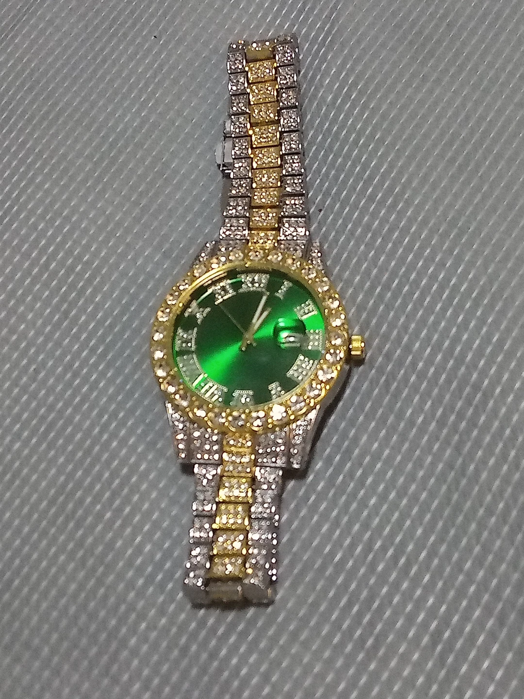 Golden tone silver diamond quartz watch