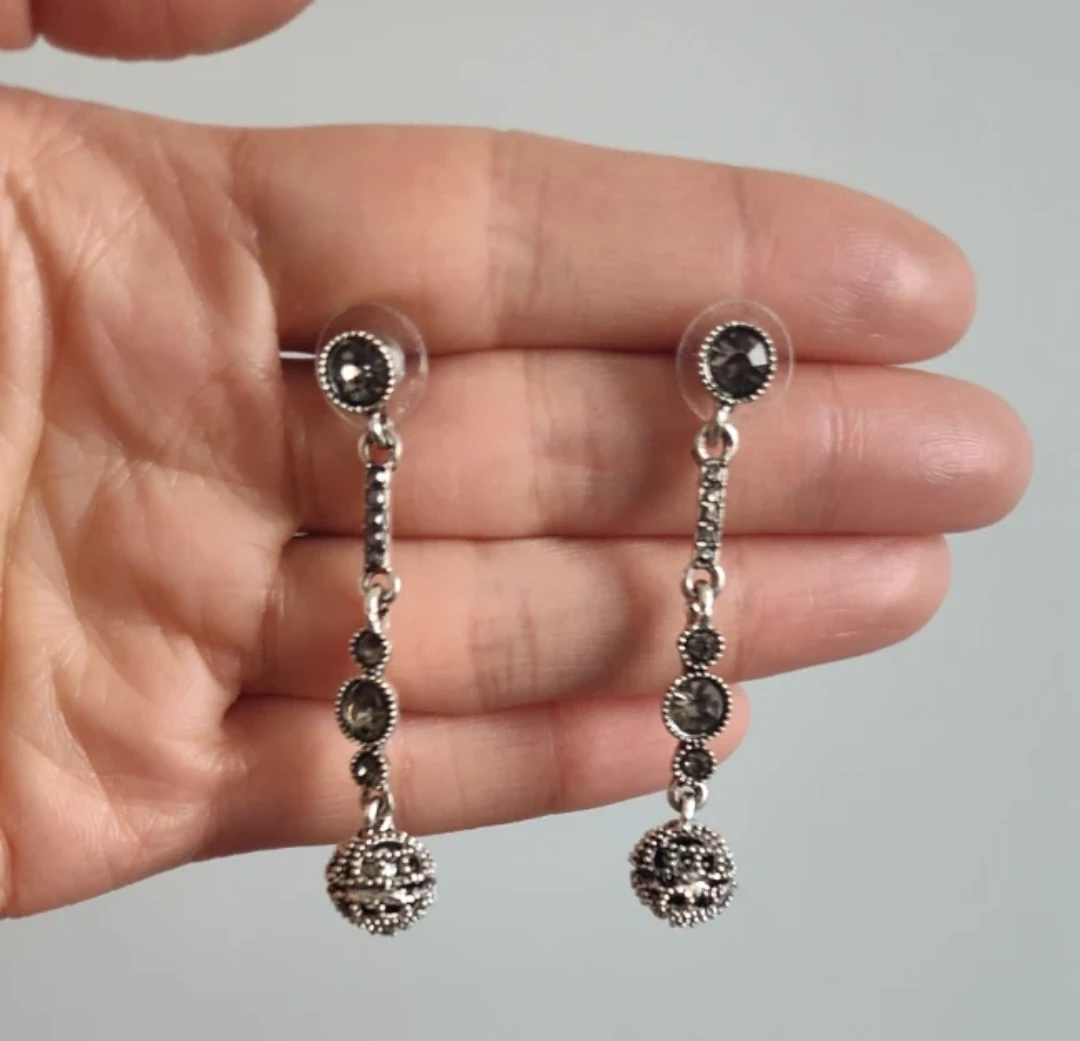 Silver-tone dangling earrings with crystal accents