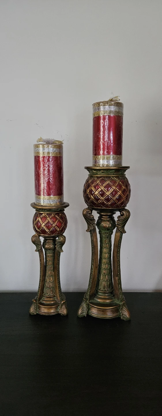 Pair of ornate red and gold candle holders