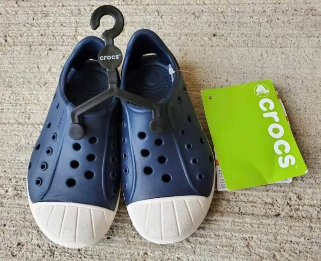 New Crocs shoes in child size 8. Pick up in Kitchener, $15