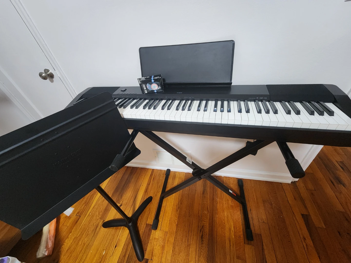 Piano metronome music sheet stand