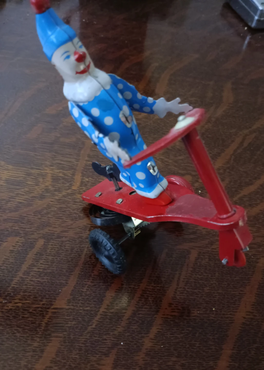 Vintage Tin Wind-Up Clown on Scooter Toy