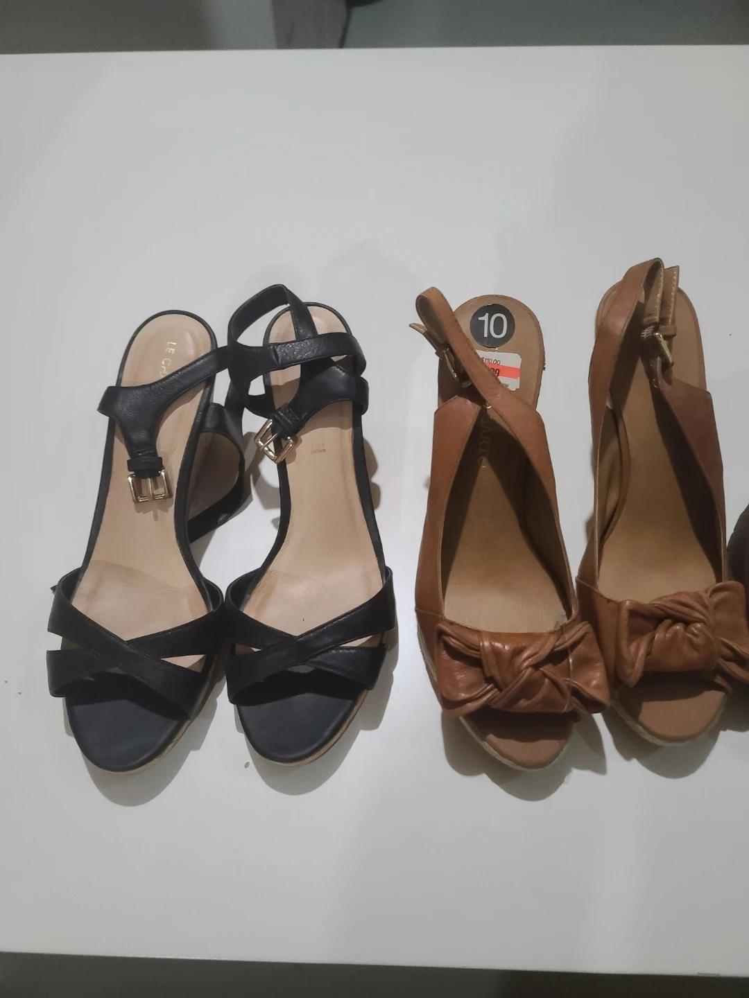 Two pairs of women's sandals, black and tan