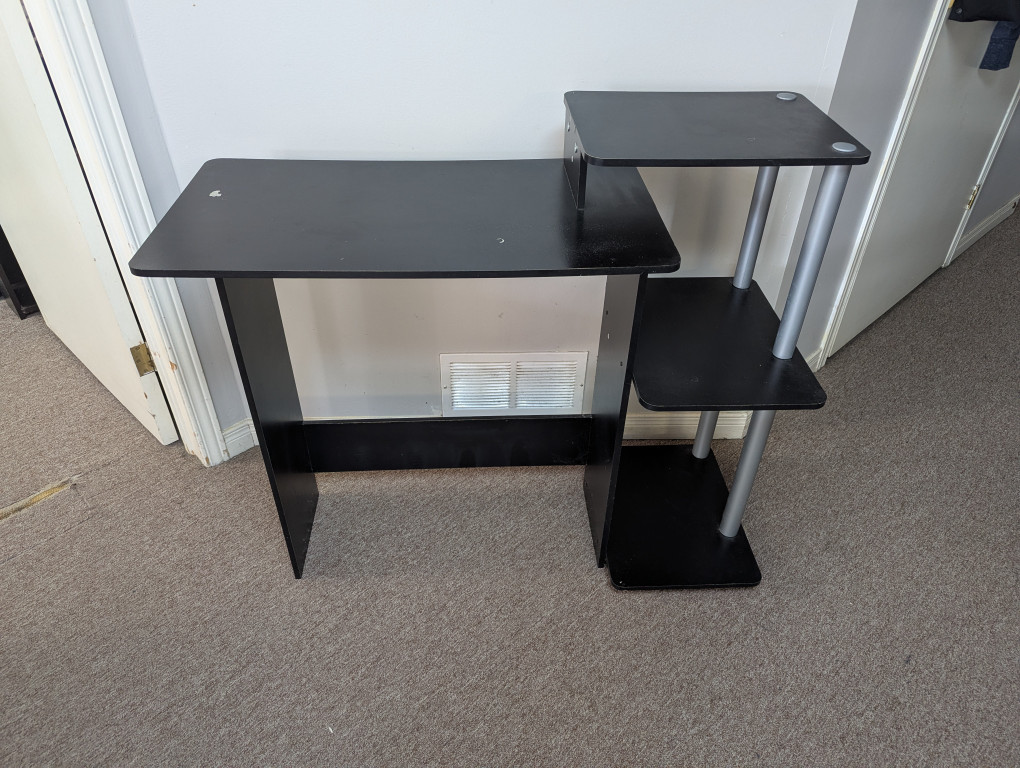 Black computer desk with shelves