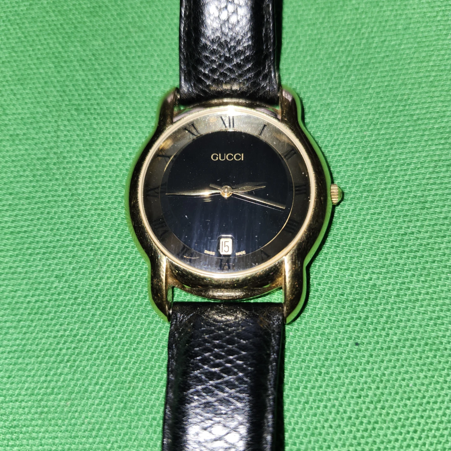 GUCCI Gold-Tone Watch with Black Leather Strap