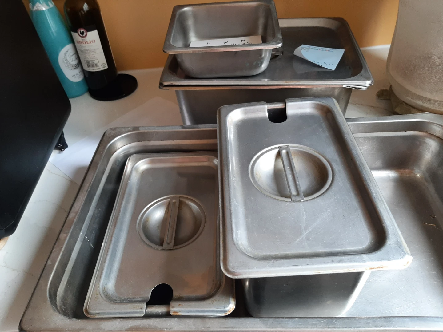 Five stainless steel stainless food presenters , 4 with lids