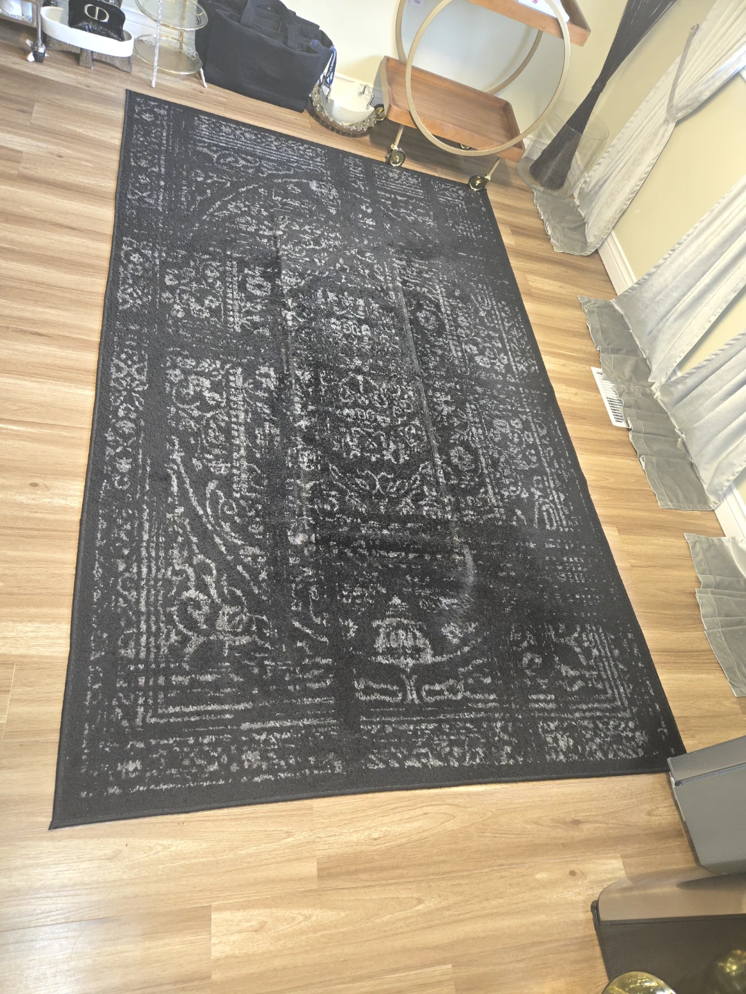 Black Area Rug with Traditional Pattern