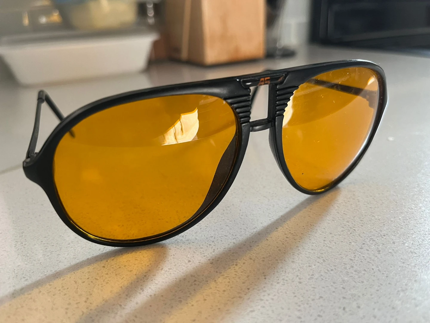 Black Aviator Sunglasses with Orange Lenses