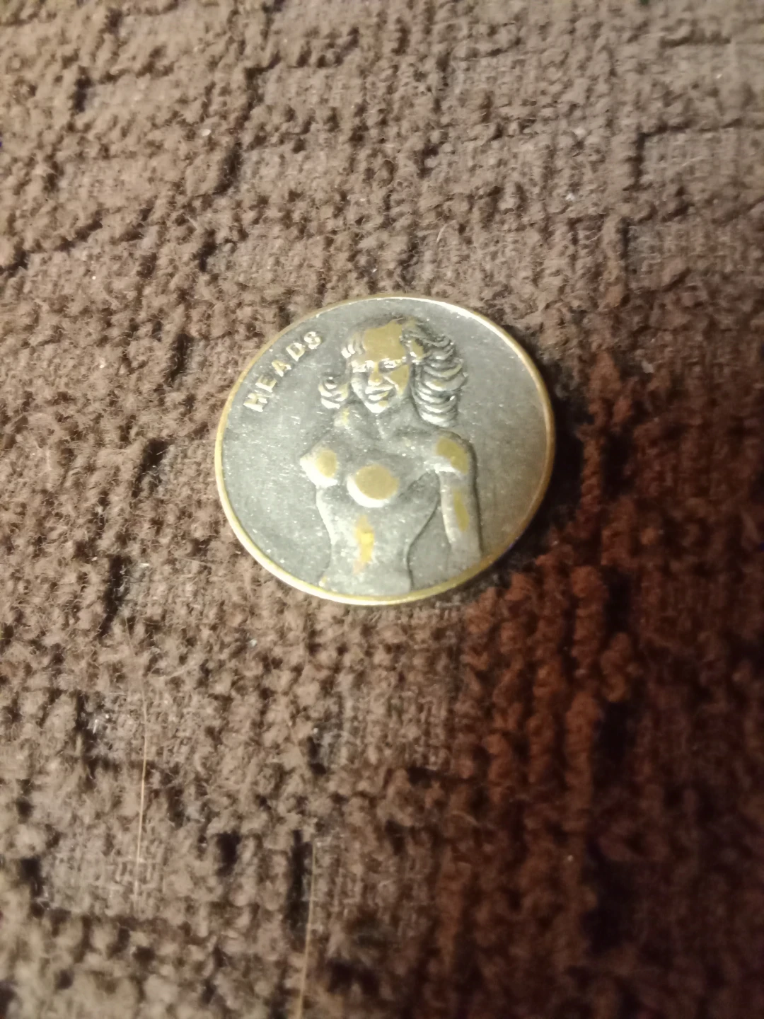 Vintage heads & tails coin.