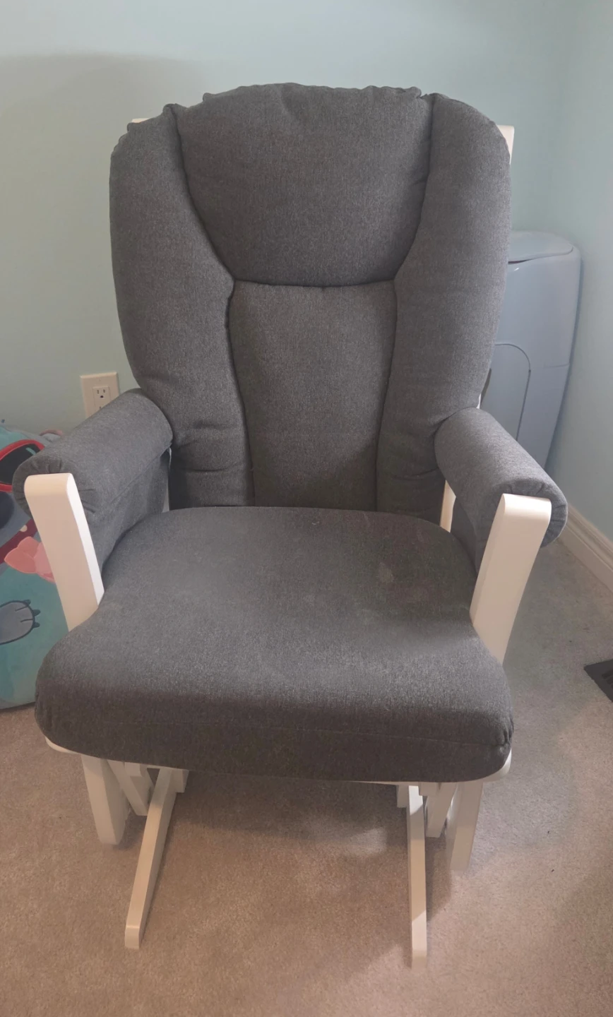 Grey upholstered glider chair
