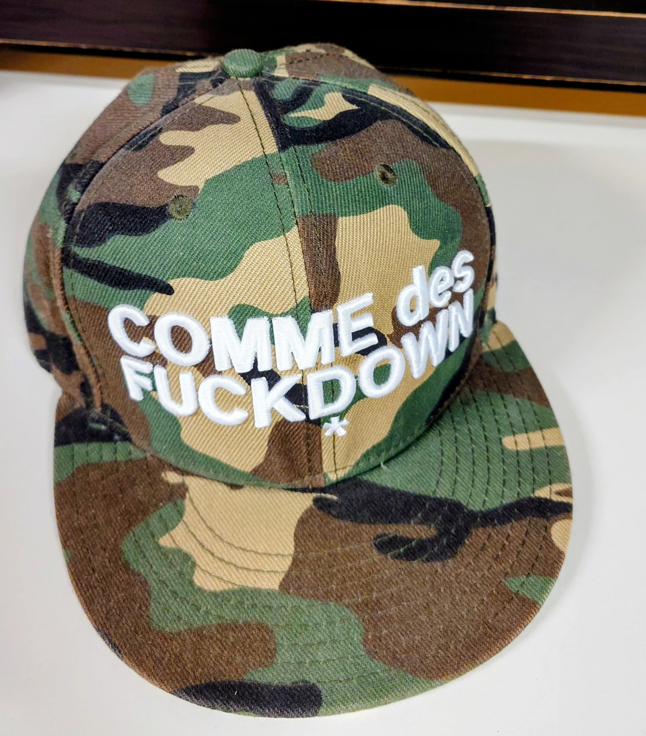 Comme des Fuckdown Camo Snapback Hat