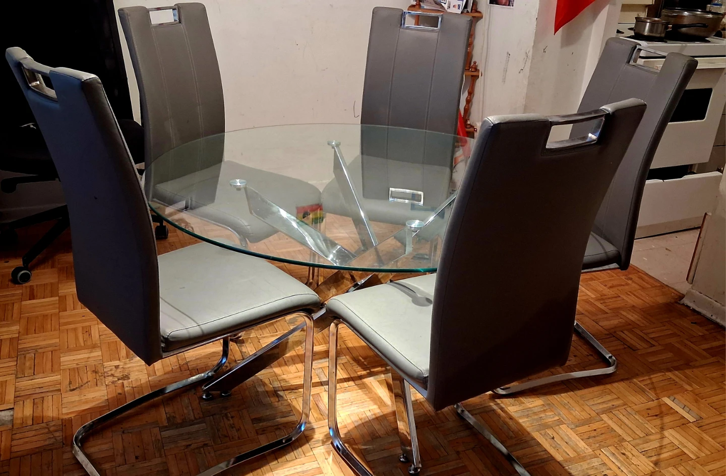 Glass Dining Table with 5 Grey Chairs