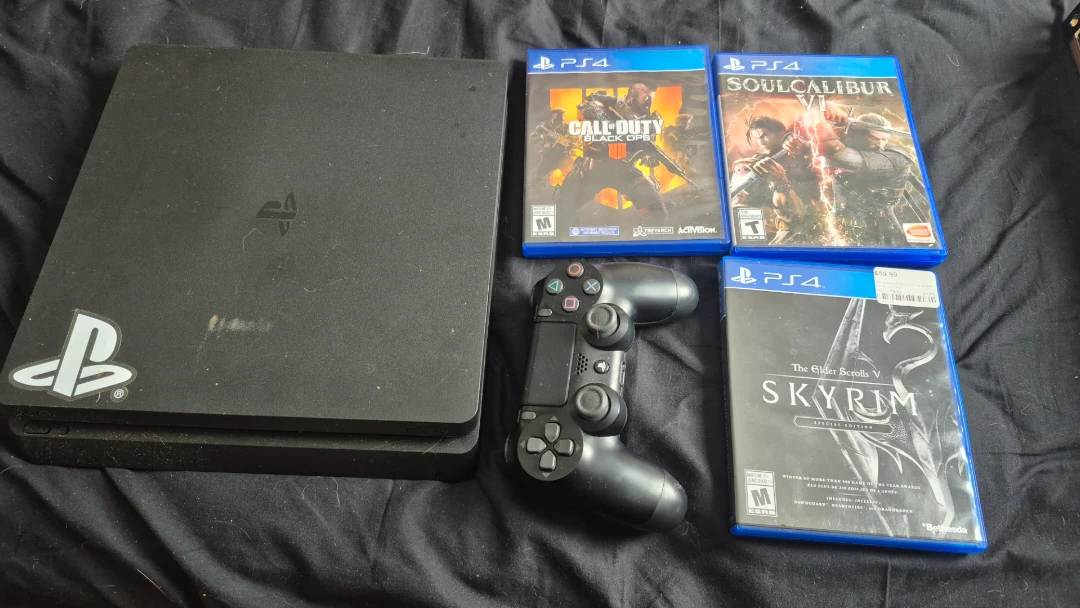 PS4 with 3 games and controller
