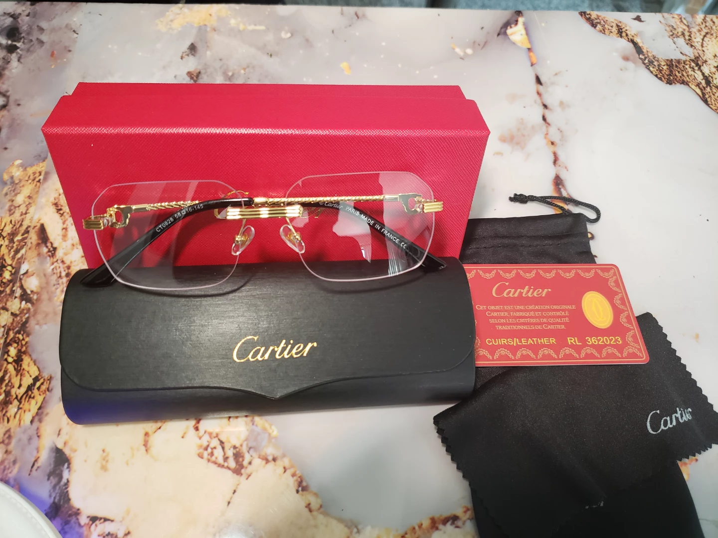 Cartier CT0028 Eyeglasses - Gold/Black Rimless 58-16-145 - photo 4
