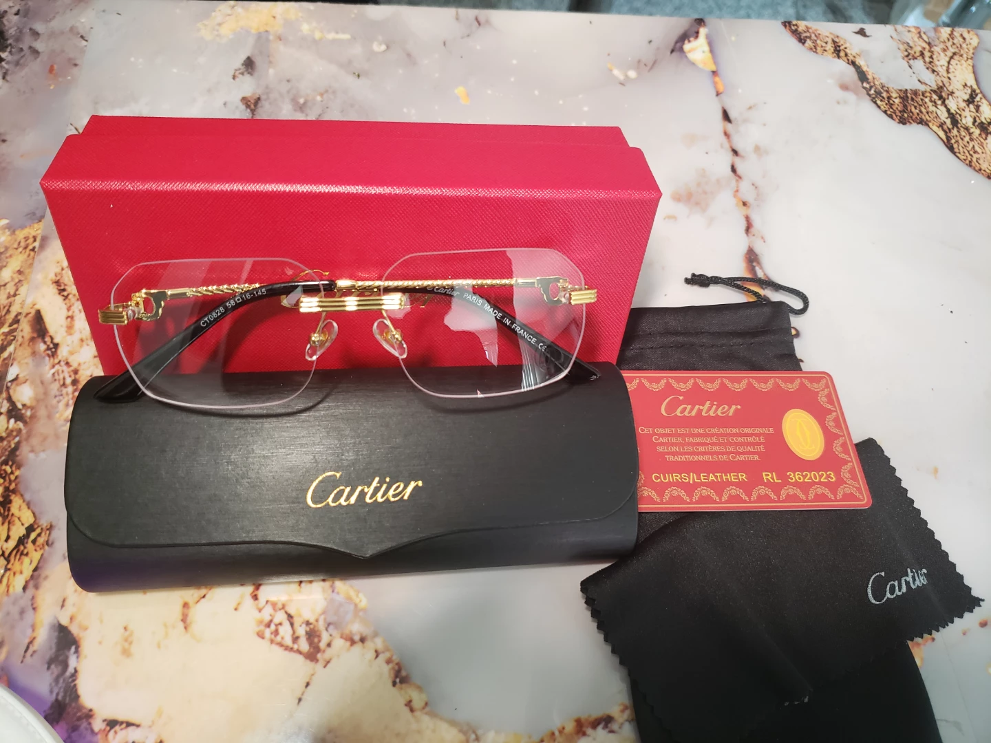Cartier CT0028 Eyeglasses - Gold/Black Rimless 58-16-145 - photo 5