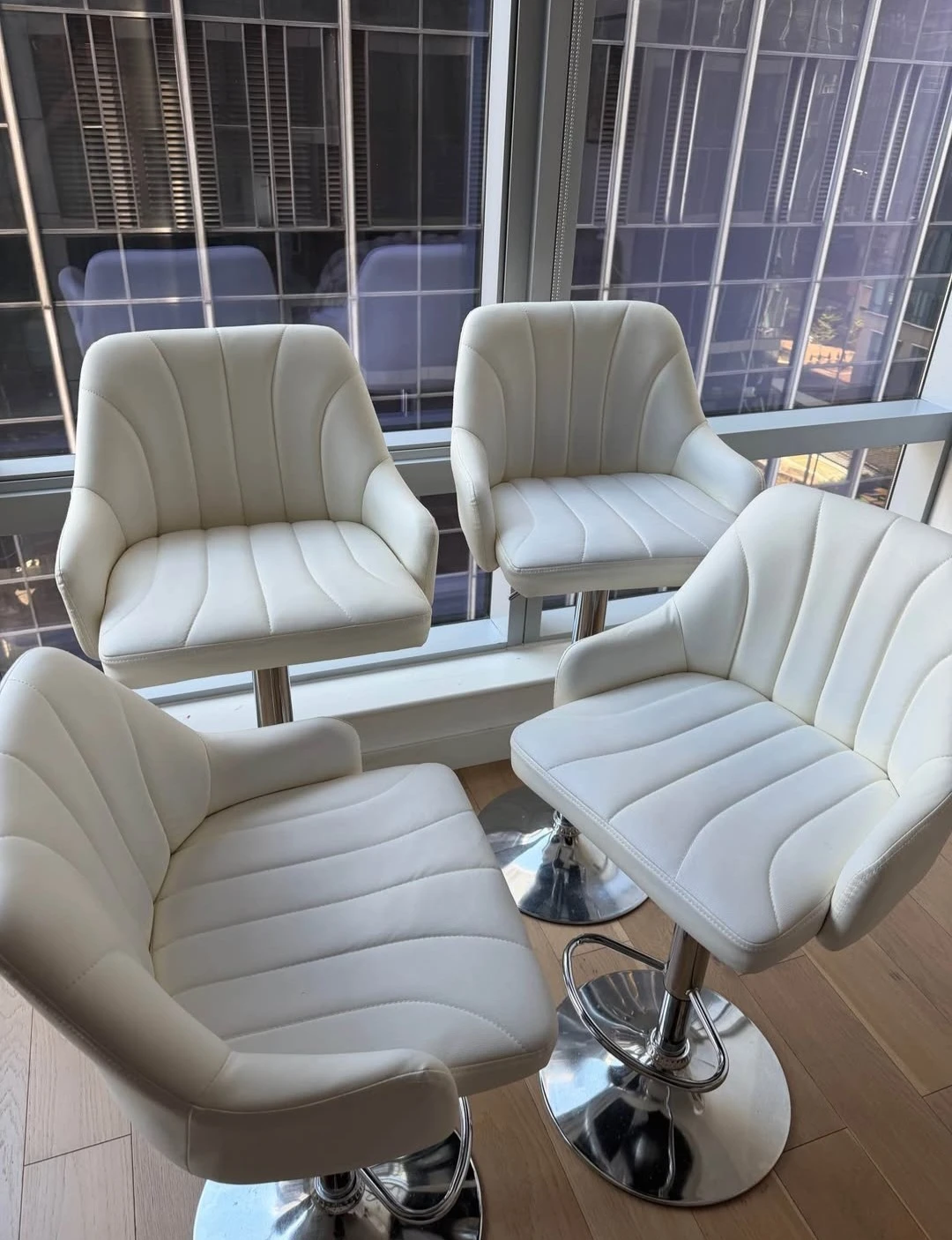Almost brand new Set of 4 White Adjustable Swivel Bar Stools