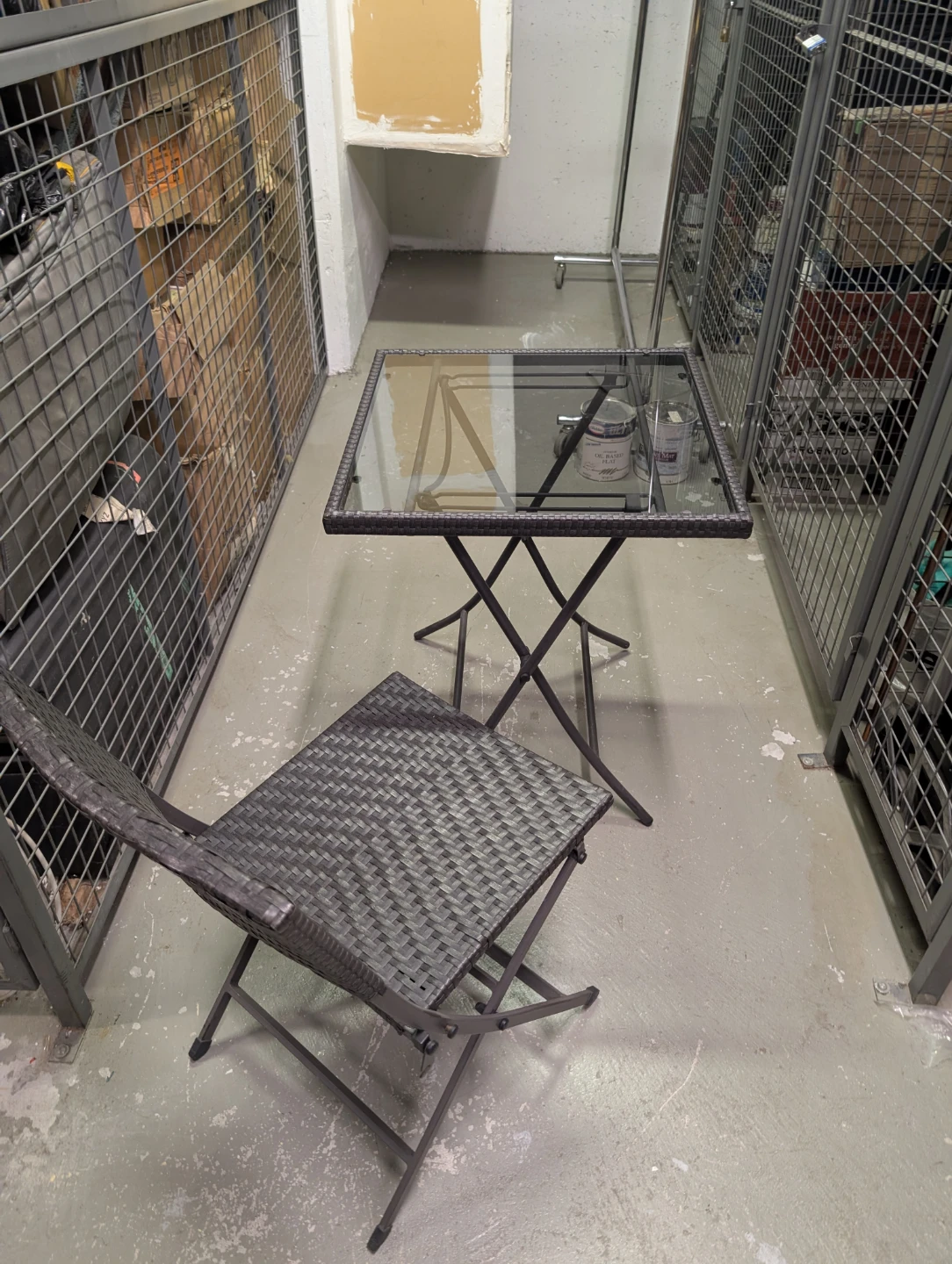 Woven outdoor chair and glass-top table set