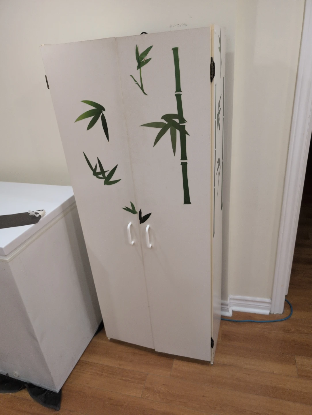 White Cabinet with Bamboo Design