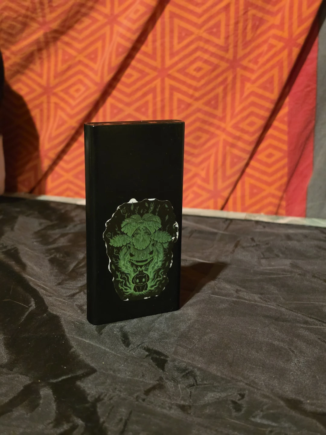 Black power bank with Pokemon stickers