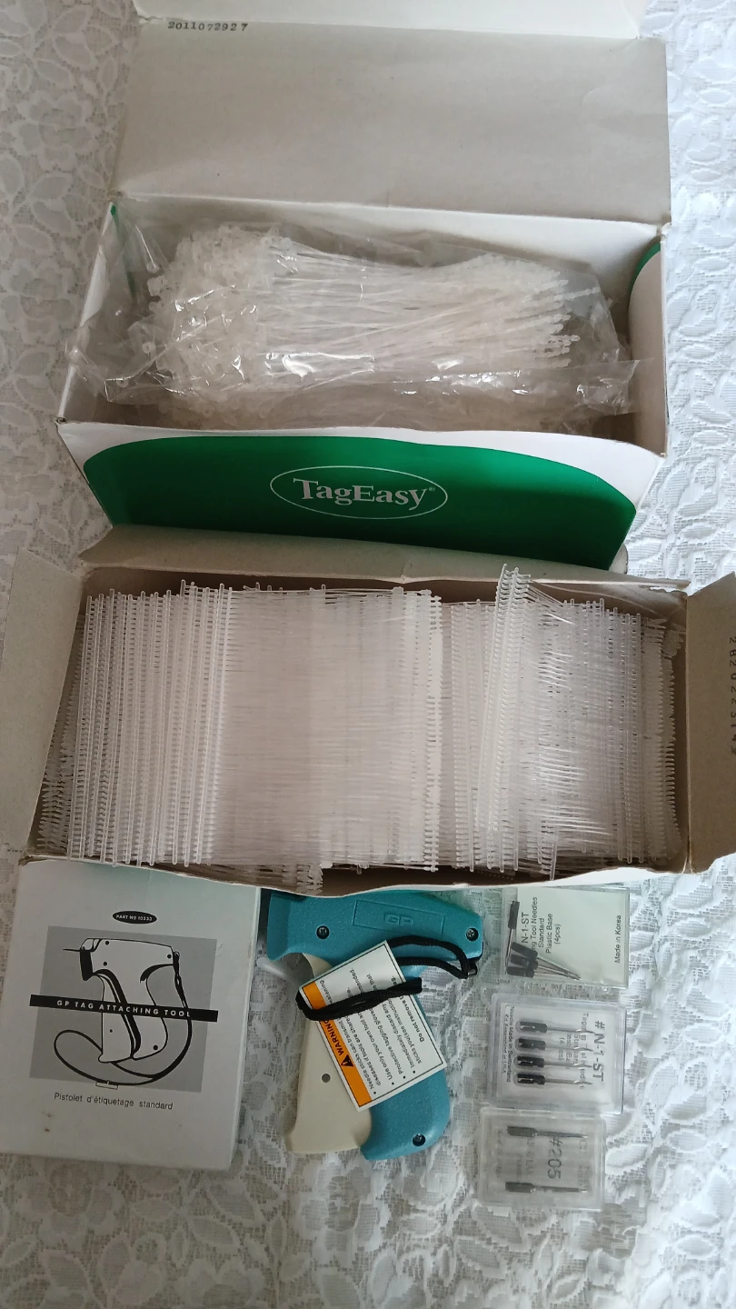 Collection of price tag fasteners and gun for $15.00