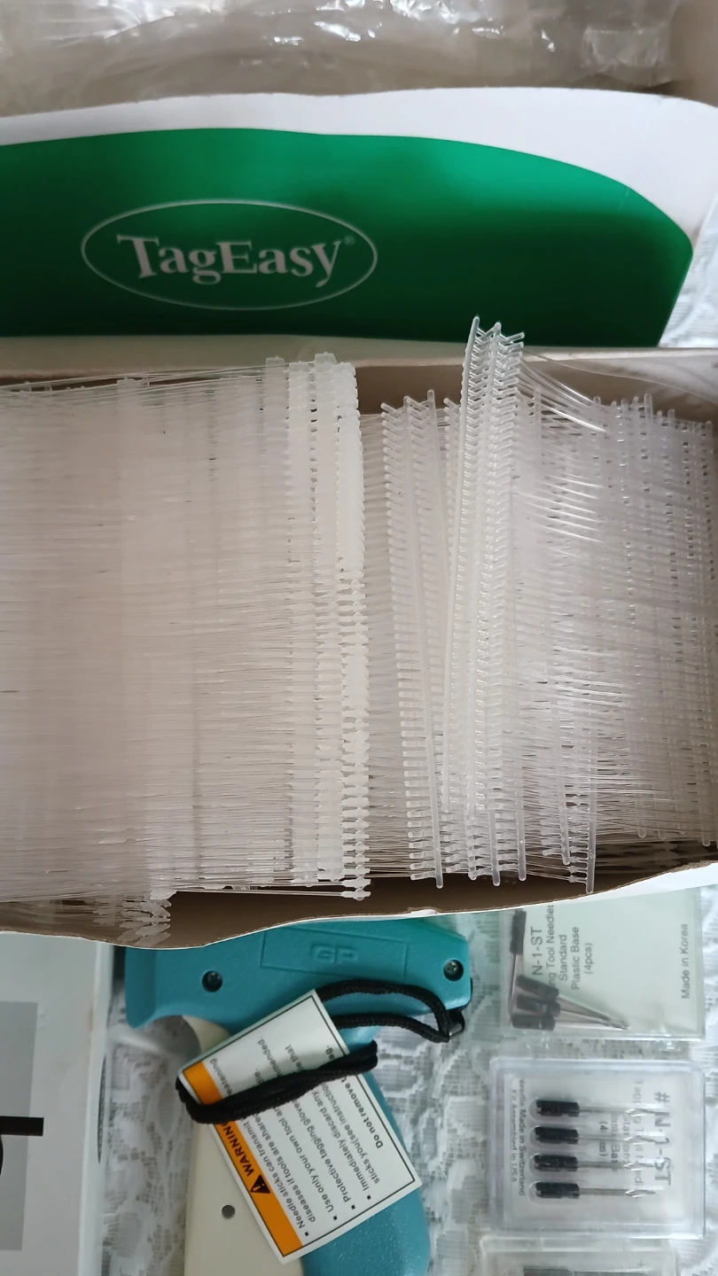 Collection of price tag fasteners and gun for $15.00 - photo 2