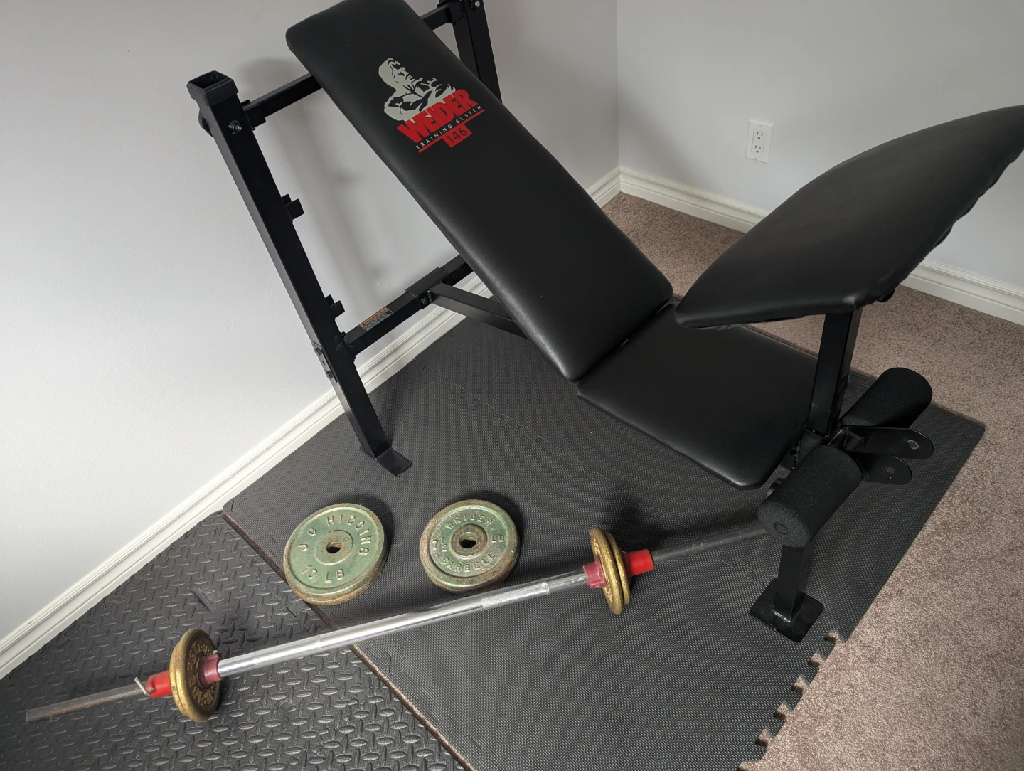 Exercise bench + straight bar + weights