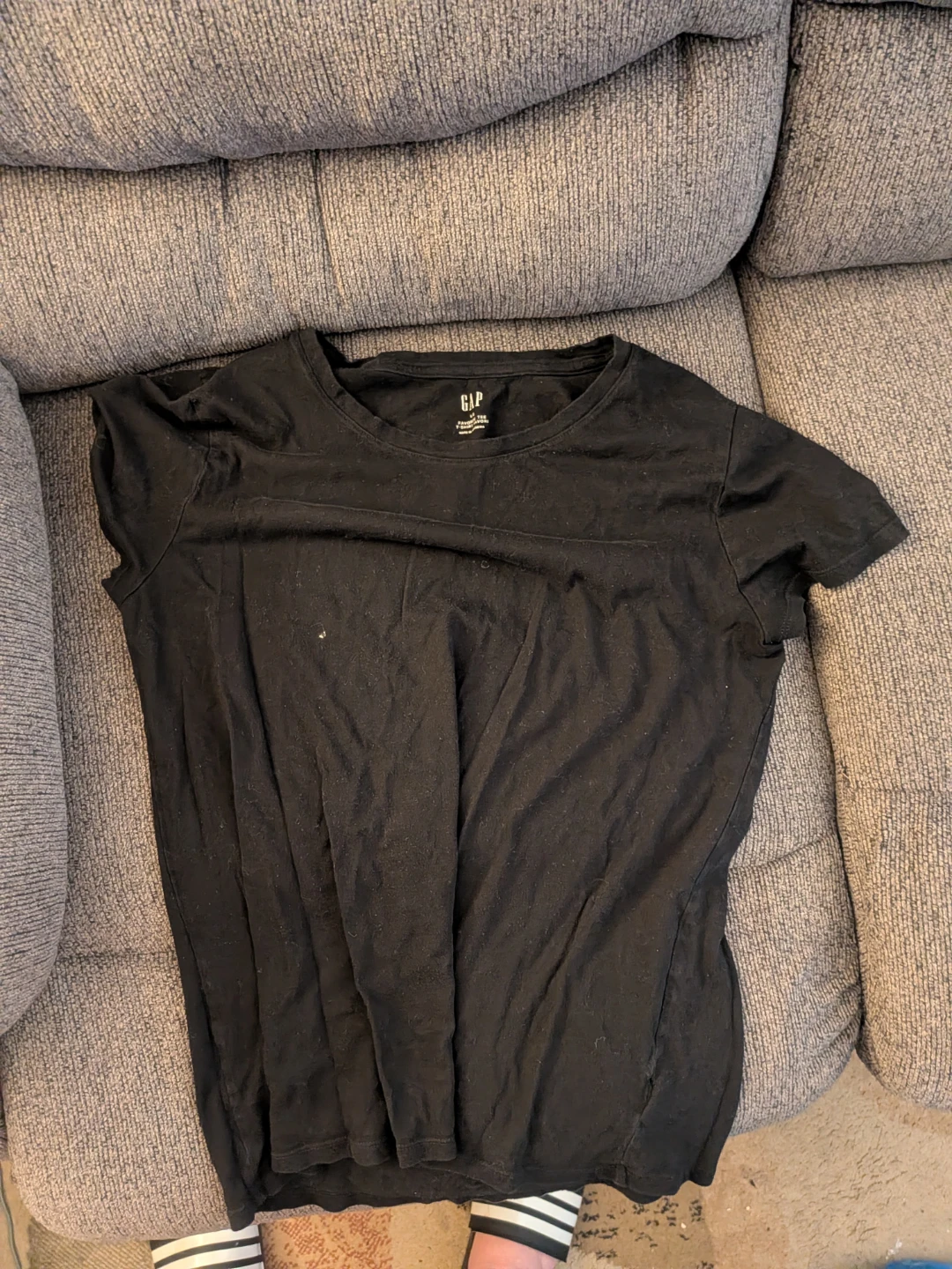 solid black, short-sleeved crew-neck top. Pick up in st Albert