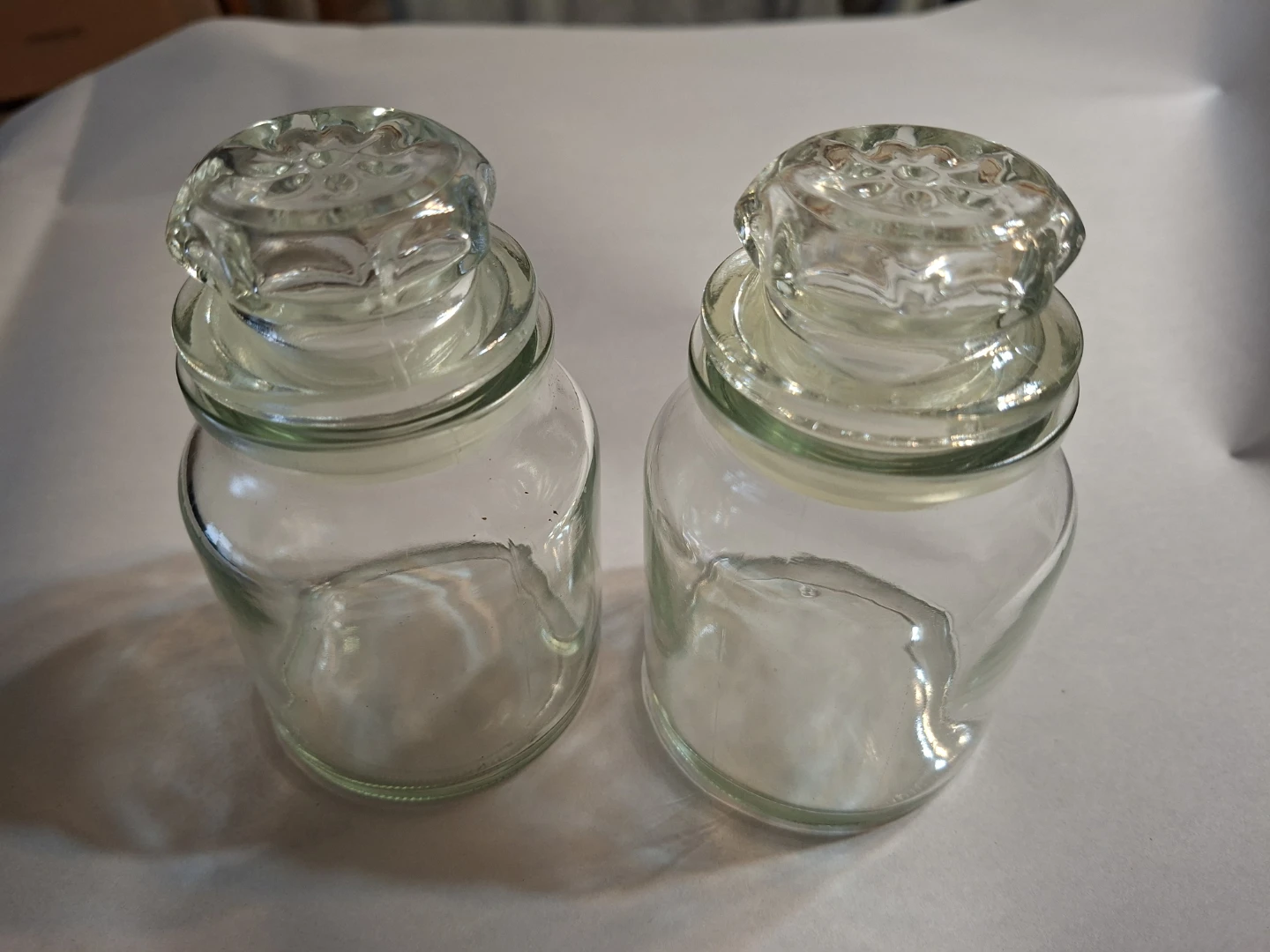 Two Glass Jars with Decorative Lids