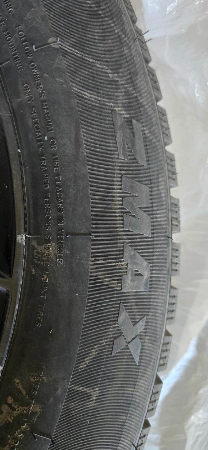 225/65R17 Winter Tires on Black Rims
