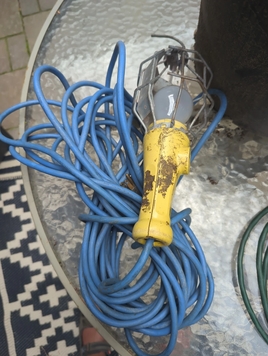Yellow work light with long blue cord
